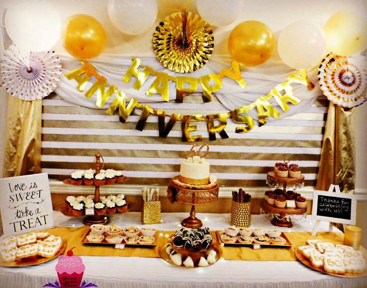 White And Gold Anniversary Dessert Table